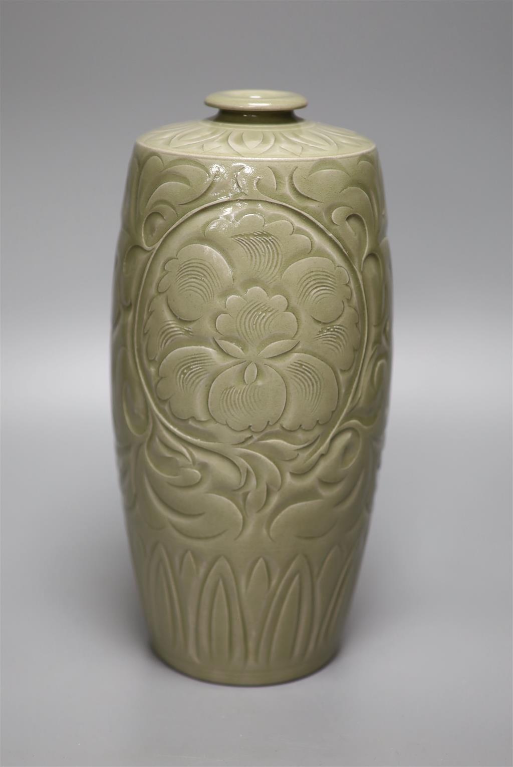A Chinese carved celadon vase, height 26cm